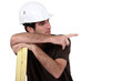 laborer leaning on planks