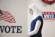 Middle Eastern voter voting in polling place