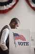 Hispanic voter voting in polling place