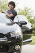 Hispanic man getting into car