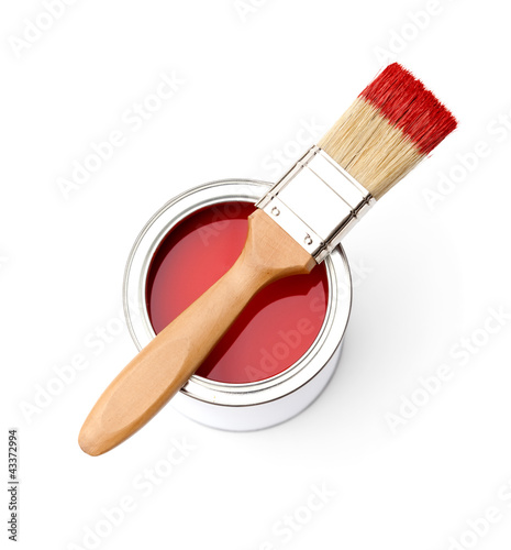 Photo: Full of red paint tin and paint brush on it, isplated on white Full of red paint tin and paint brush on it, isplated on white