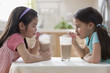 Girls drinking chocolate milk together
