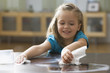 Caucasian girl wiping up spilled milk