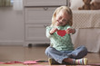 Caucasian girl holding Valentine heart