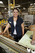 Hispanic woman working on assembly line