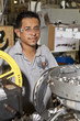 Hispanic man working on assembly line