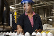 Hispanic woman working on assembly line
