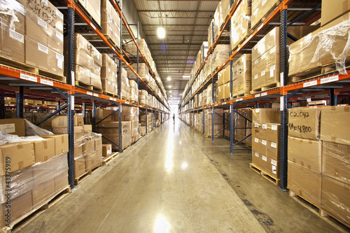 Photo: Shelves and boxes in warehouse Shelves and boxes in warehouse