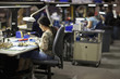 Foto: Asian woman working in electronics factory Asian woman working in electronics factory