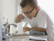 Caucasian boy brushing teeth