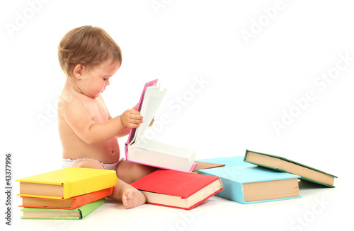 Photo: Cute baby with books isolated on white Cute baby with books isolated on white