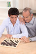 Father and son playing chess