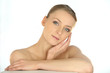 Portrait of a woman stroking her face