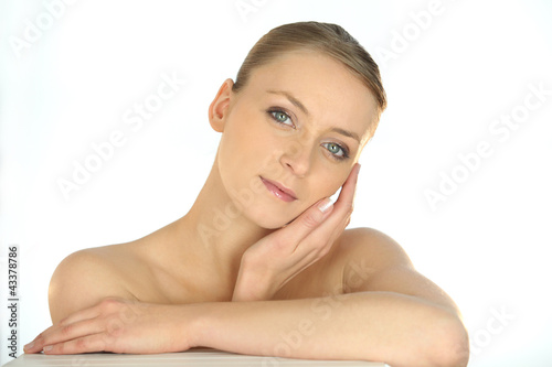 Photo: Portrait of a woman stroking her face Portrait of a woman stroking her face