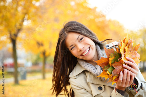 Photo: Fall woman playing with leaves Fall woman playing with leaves