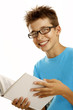 Foto: schoolboy reading a book schoolboy reading a book