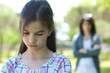 Little girl being told off