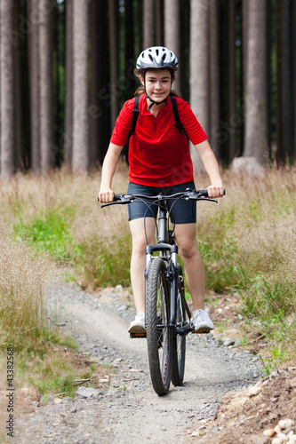 Photo: Girl biking Girl biking