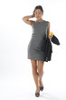 Photo: healthy young executive woman, walking holding an apple. healthy young executive woman, walking holding an apple.