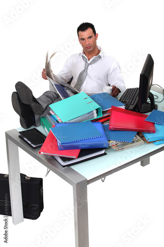 Photo: Overwhelmed executive Overwhelmed executive