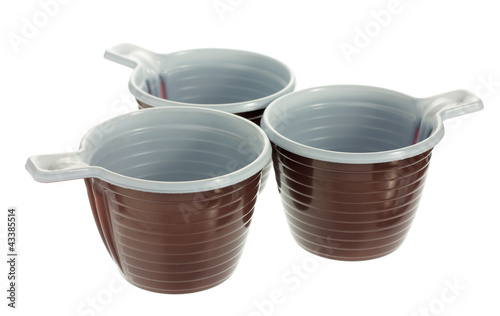Photo: Three disposable plastic brown coffee cups Three disposable plastic brown coffee cups