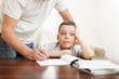 Father helping son do homework