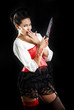 Foto: attractive brunette woman with bloody knife attractive brunette woman with bloody knife