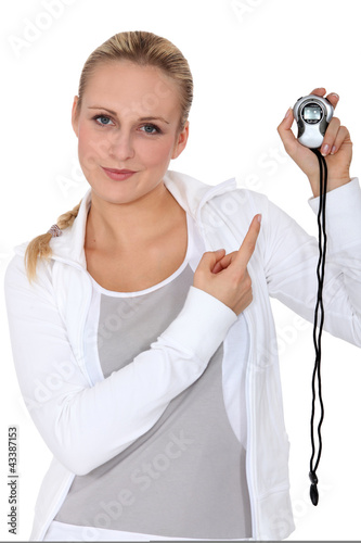 Photo: Woman runner with a stopwatch Woman runner with a stopwatch