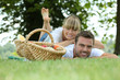 Couple lying in grass
