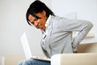 Photo: Pretty young woman with back pain Pretty young woman with back pain
