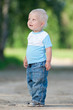 Photo: Happy little boy in the green park Happy little boy in the green park