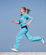 Sportswoman running outdoors