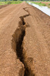 Gravel road in rural split apart.