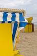 detail of barricaded wicker beach chair, stormy weather