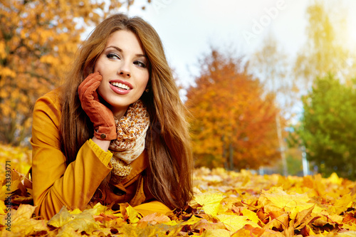 Photo: young brunette woman portrait in autumn color young brunette woman portrait in autumn color