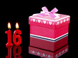 Birthday  gift with red candles showing Nr. 16