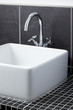 Sink tap in contemporary bathroom
