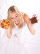 Photo: Beautiful blond girl having decision what to eat Beautiful blond girl having decision what to eat