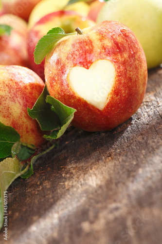 Photo: Delicious red apple with heart cutout Delicious red apple with heart cutout