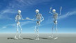 Three skeletons dancing.