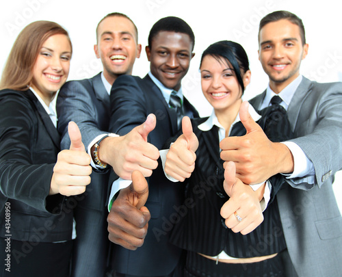 Photo: Business group with thumbs up isolated over white Business group with thumbs up isolated over white