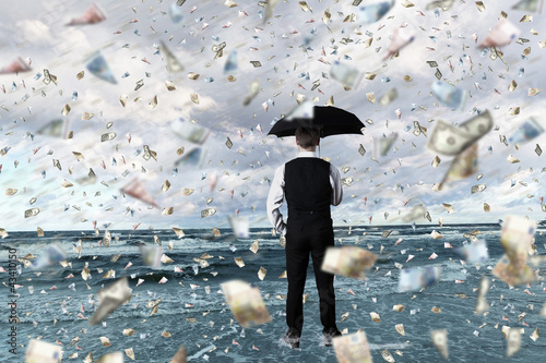 Photo: Money rain and businessman with umbrella Money rain and businessman with umbrella