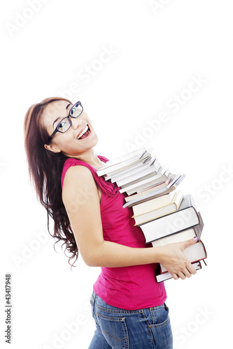 Photo: College student carrying books College student carrying books