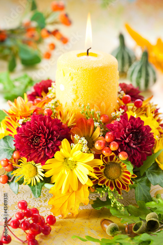 Photo: wreath of autumn flowers and candle wreath of autumn flowers and candle