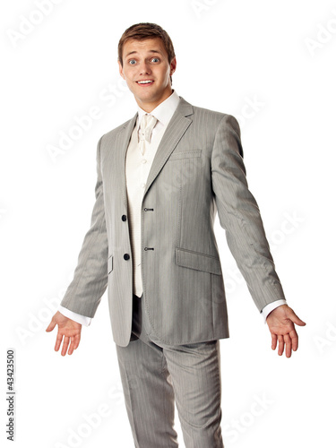 Foto: Young Caucasian man in a suit looking amazed Young Caucasian man in a suit looking amazed