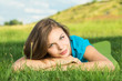 Young female relaxing in the grass