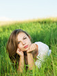Young female relaxing in the grass