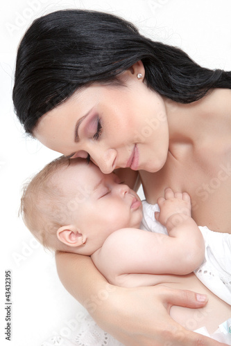 Photo: picture of happy mother with baby over white picture of happy mother with baby over white