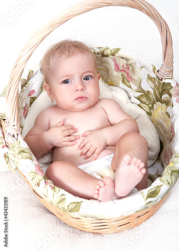 Photo: Portrait newborn baby in basket Portrait newborn baby in basket