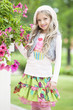 Girl at flower bush